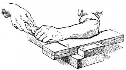 Fig. 66.Chiselling away Wood up to Gauge Line.